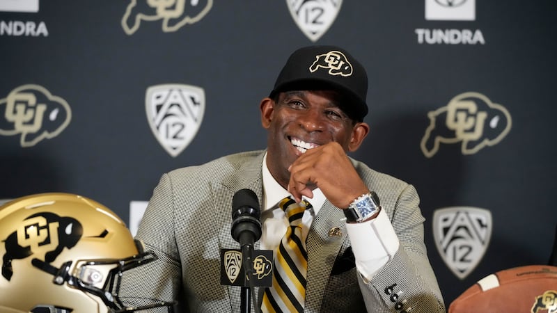 FILE - Deion Sanders speaks after being introduced as the new head football coach at the...