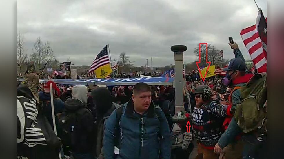 Hamner with the billboard used to break through police lines.