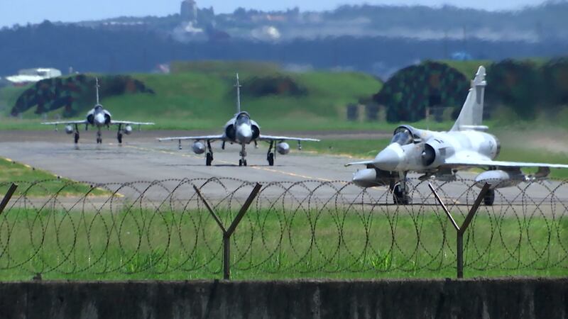 FILE PHOTO - Taiwan Air Force Mirage fighter jets taxi on a runway at an airbase in Hsinchu,...
