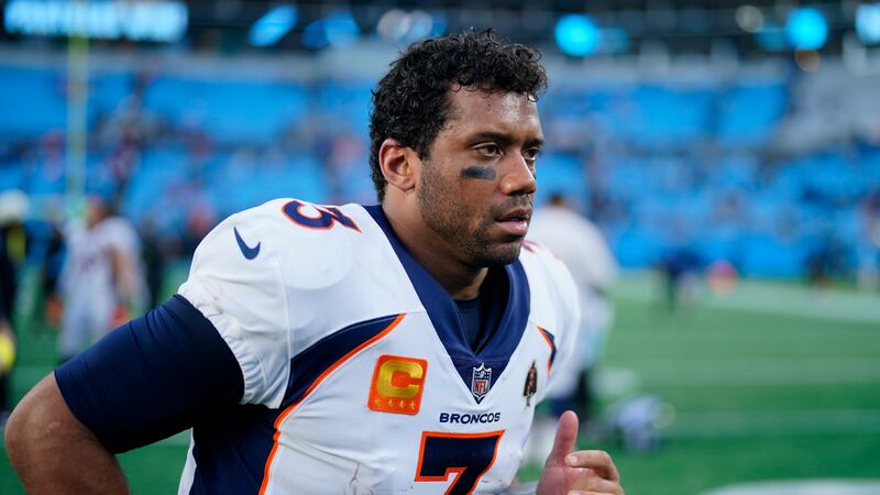 Denver Broncos quarterback Russell Wilson leaves the field after their loss during an NFL...