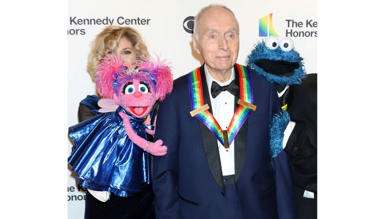 FILE - Honoree Lloyd Morrisett appears with muppet characters at the 42nd Annual Kennedy...