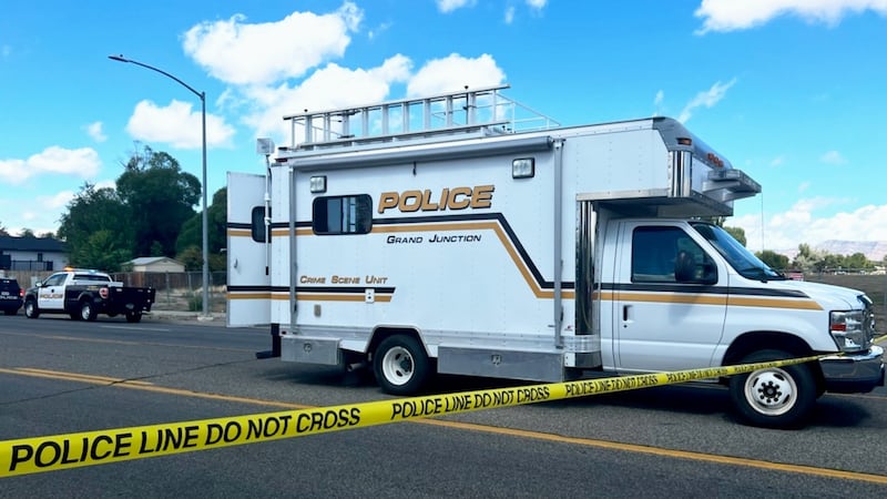 A GJPD Crime Scene Unit sits near the scene of the accident, flush with the police cordon.