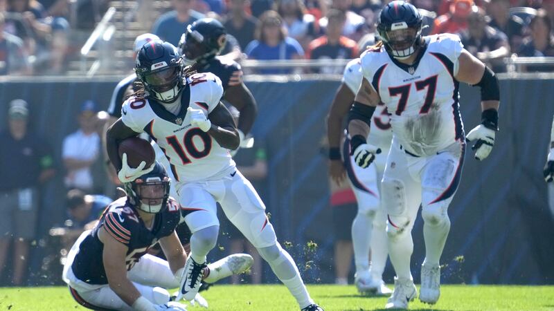 Denver Broncos wide receiver Jerry Jeudy (10) advances the ball off a reception from...