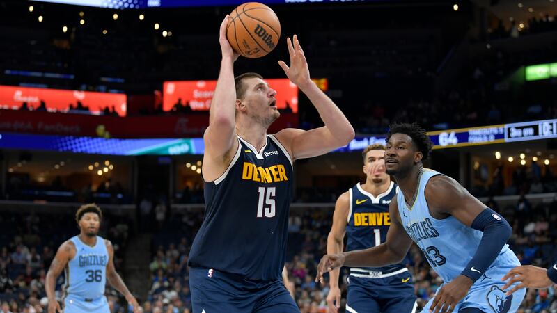 Denver Nuggets center Nikola Jokic (15) looks to shoot against Memphis Grizzlies forward Jaren...
