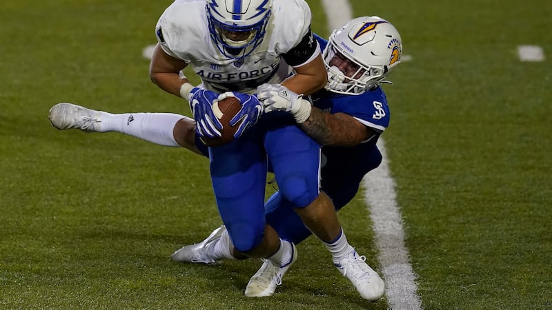 Air Force tight end Kyle Patterson, left, catches a pass in front of San Jose State linebacker...